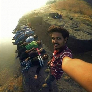 SELFIE FROM A MOUNTAIN CLIFF